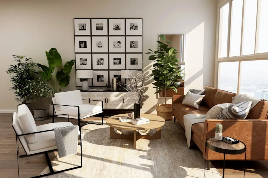 Sunlit living room with a white lounge chair, a tan leather sofa, a round timber coffee table and a single grid of framed photographs on a pale wall
